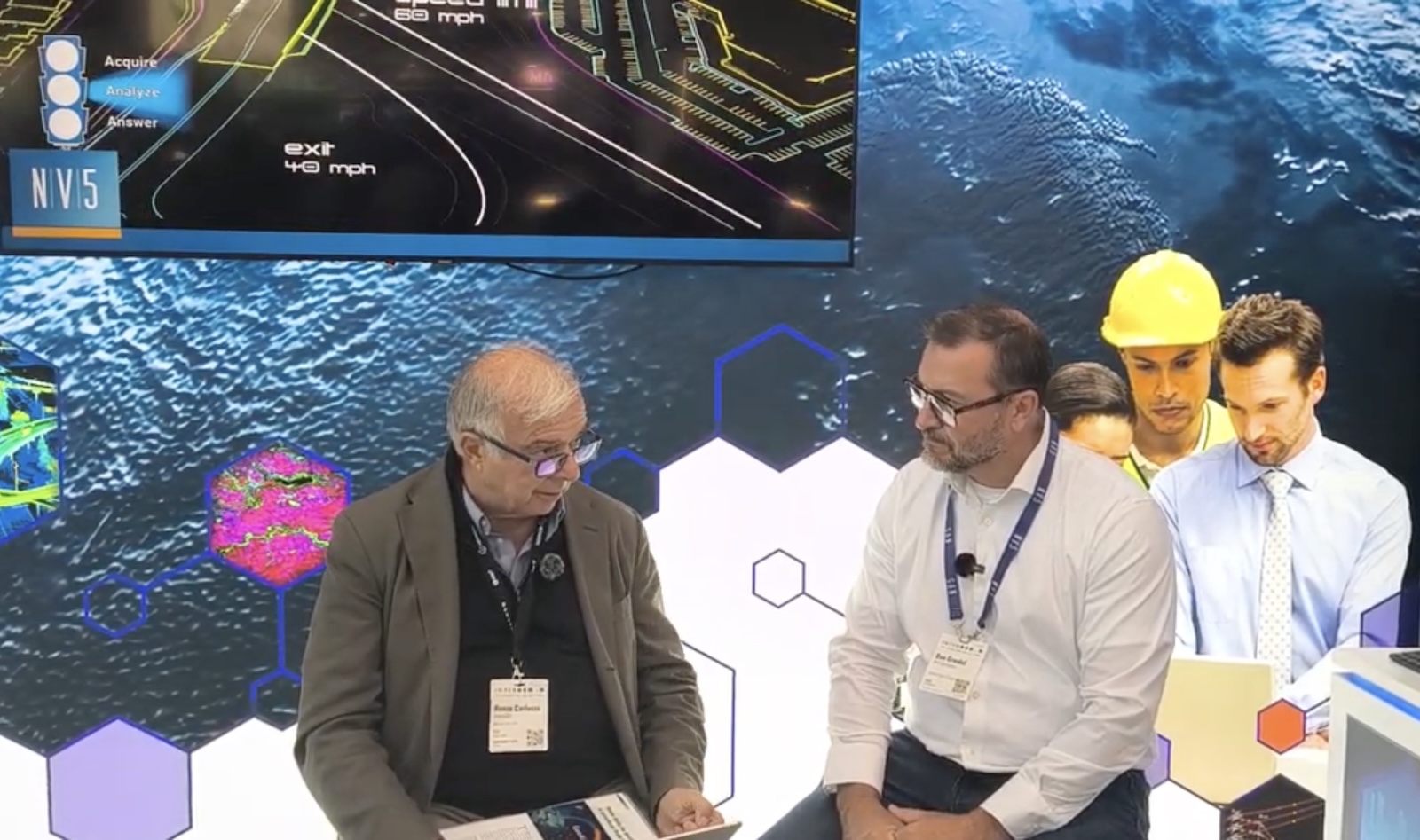Renzo Carlucci of GEOmedia talks with Dan Grudel of NV5 Geospatial at INTERGEO 2026 in Munich